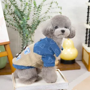 Close-up of denim and fleece pet coat with bear print and metal D-ring for dogs