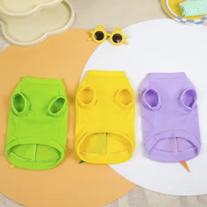 Three colorful waffle-knit pet t-shirts in lime green, bright yellow, and soft purple