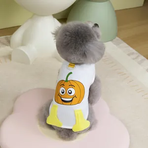 Close-up of pet vest with orange cartoon pumpkin print and 3D yellow boot accents