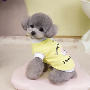Detail of breathable yellow pet t-shirt with cute puppy print and white ribbed collar