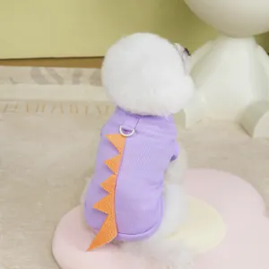 Detail of purple dinosaur pet shirt featuring orange back fins and a functional D-ring