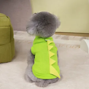 Detail of green dinosaur pet t-shirt with yellow back fins and a sturdy metal D-ring
