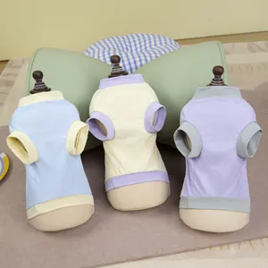 Three breathable mesh pet t-shirts in pastel colors displayed on mannequin stands