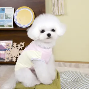 Close-up of breathable mesh fabric on a pink and yellow pet vest for small dogs