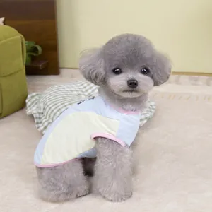 Detail of breathable ice silk mesh pet vest on grey poodle in cozy home setting