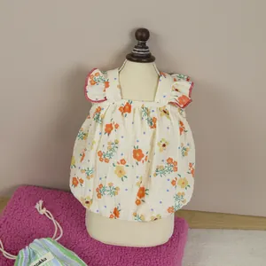 Floral pet dress with red ruffle sleeves for small dogs and cats in floral bubble gauze
