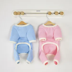 Cozy waffle fabric pet pajamas in light blue and pink with four-leg ribbed design