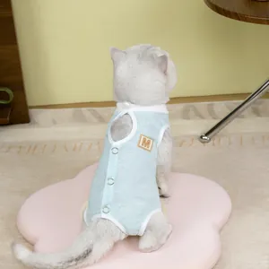 Detail view of breathable blue mesh pet suit with metal snaps and leather M-letter patch