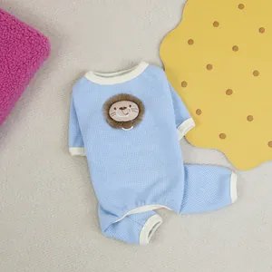 Light blue waffle knit pet pajamas with lion patch for cats and small dogs