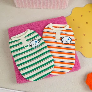 Colorful striped pet vest with dog embroidery patch and metal D-ring on soft pink fur fabric