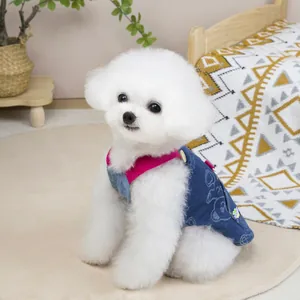 Dog denim vest with pink straps and cartoon bear print for small pets on a puppy