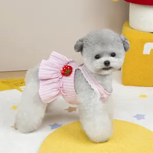 Detail of pink striped pet dress featuring 3D strawberry and delicate white lace trim