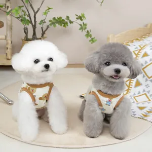 Beige cotton waffle pet vest with bear print for small dogs shown in a cozy setting