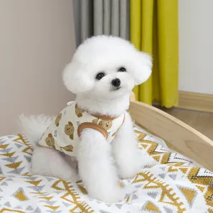 Detail of pet summer vest featuring bear print and brown knitted piping on white dog