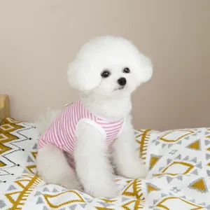 Detailed close-up of a pink striped pet vest on a small white dog with mesh fabric texture