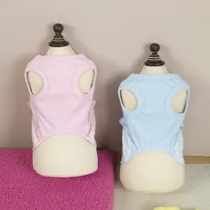 Pink and blue sleeveless ribbed pet vests for cats and small dogs on mannequin stands