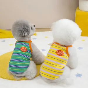 Colorful striped pet vest with orange trim and Good Luck embroidery for small dogs