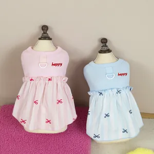 Pink and blue pet dress with happy embroidery and D-ring for leash attachment