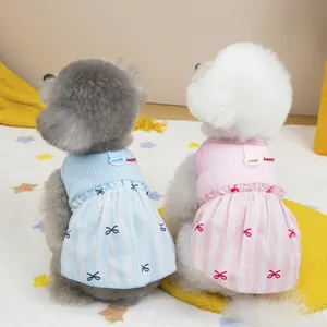 Cute pink and blue pet summer dresses with happy embroidery and bow patterns for small dogs