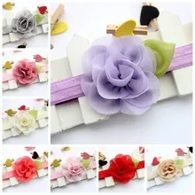 Detail showing various colors of chiffon rose headbands for babies with elastic lace band
