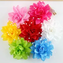 Detail of multi-colored silk flower petals with white bead accents for DIY hair accessories