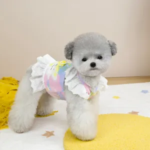 Close-up of tie-dye pet harness dress with delicate white lace trim and D-ring detail