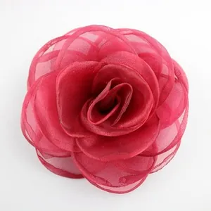 Detail showing the multi-layered burgundy mesh fabric flower for DIY hair accessories