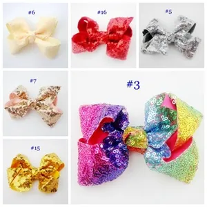 Collage of colorful glittery striped bow hair clips in various vibrant fabric styles