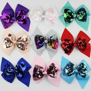 Set of nine glittery sequin bows in various colors for DIY hair accessories