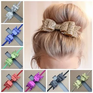 Glitter fabric bow hair accessories shown in multiple colors including gold and silver