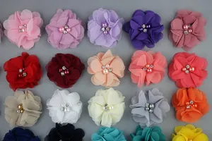 Matrix of colorful chiffon flowers featuring central pearl and rhinestone embellishments