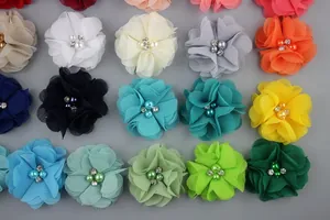 Matrix display of multi-layer chiffon flowers with pearls and rhinestones in various colors