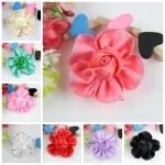 Detailed view of handmade chiffon rose flower accessories in various pastel colors