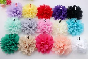 Macro shot of 15 colorful chiffon fabric flowers for DIY hair accessories and clothing