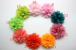 Detailed view of nine colorful multi-layered chiffon flowers for hair accessories