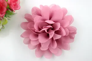 Macro detail of multi-layered pink chiffon fabric flower for hair accessories and garments