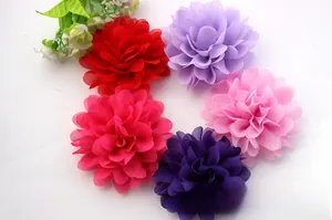 Detailed close-up of layered chiffon fabric flowers in multiple vibrant colors for DIY crafts