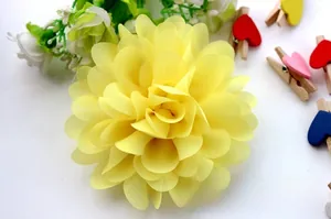 Close-up of a vibrant yellow multilayered chiffon flower hair clip for girls