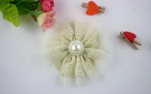 Detail of 9cm lace flower applique with mesh layers and center pearl decoration