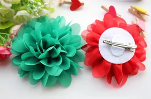 Detail view of multi-layered chiffon flower hair clips with metal duckbill clip backing
