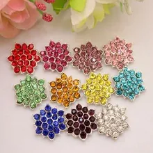 Detailed flat lay of 11 multi-colored floral rhinestone patches for DIY crafts