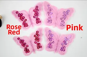 Detail of sequined butterfly patches in rose red and pink for DIY clothing accessories