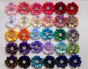 Detailed grid of 30 colorful satin ribbon flowers with sparkling rhinestone center pieces