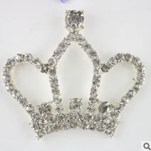Detailed view of princess crown hair clip with shimmering silver rhinestones