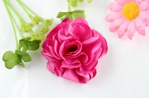 Handmade bright pink fabric flower brooch and clip accessory with satin finish
