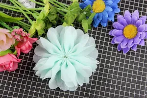 Macro view of mint green layered chiffon flower for DIY hair accessories and clothing