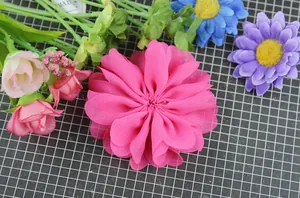 Detailed view of layered rose red chiffon wavy flower head for DIY accessories