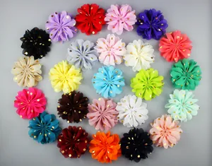 Top view of 22 colorful chiffon flowers with gold foil dots for DIY headwear crafts