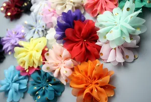 Macro detail of 8cm chiffon flowers with gold foil polka dots for DIY hair accessories