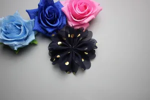 Detail of 8cm handmade navy chiffon flower with gold polka dots for garment accessories